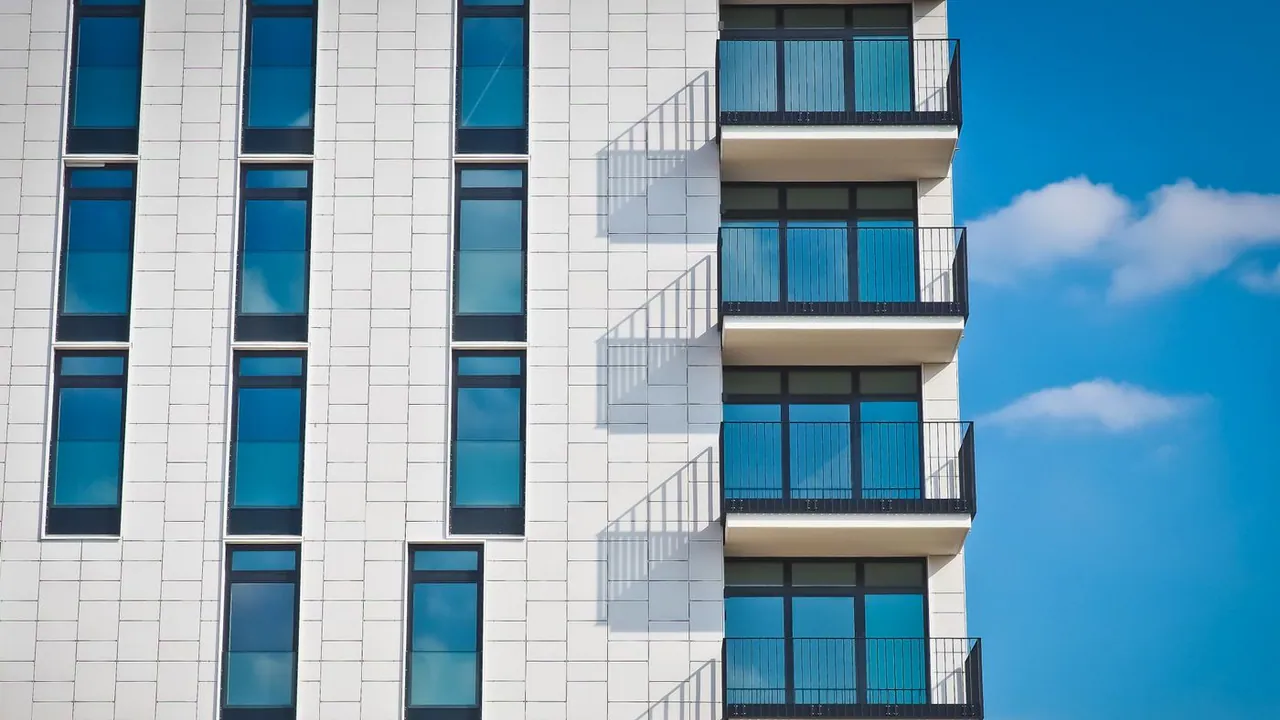 Balconies on a coastal condo tower — smoke and odor travel vertically between Highland Beach units through shafts and shared ventilation