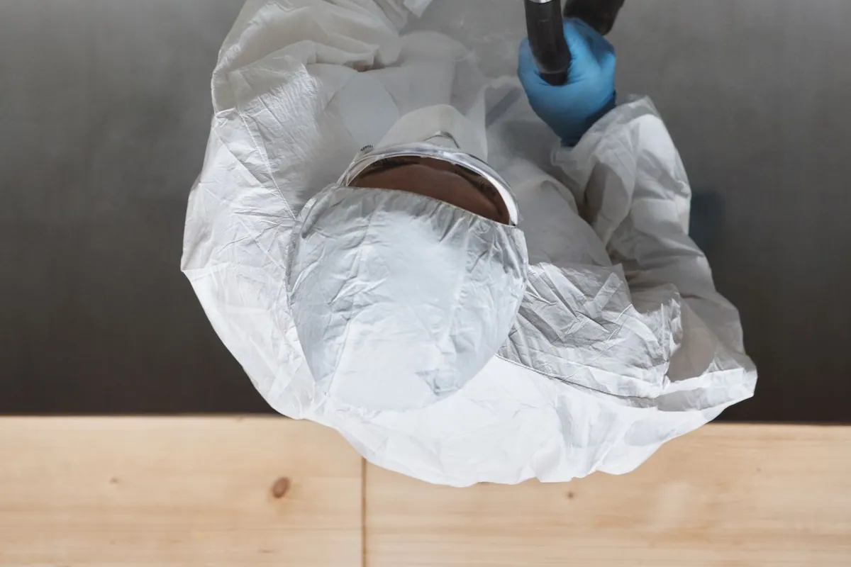 Technician deodorizing a home after a fire to remove embedded smoke smell